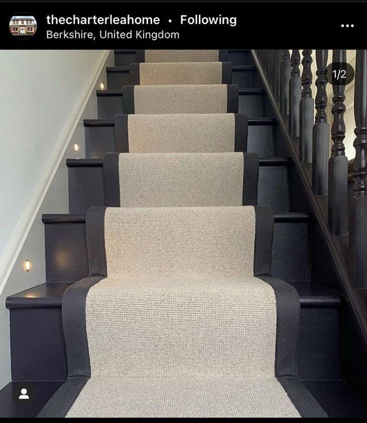 Beige Berber stair runner with black stitched taped edge