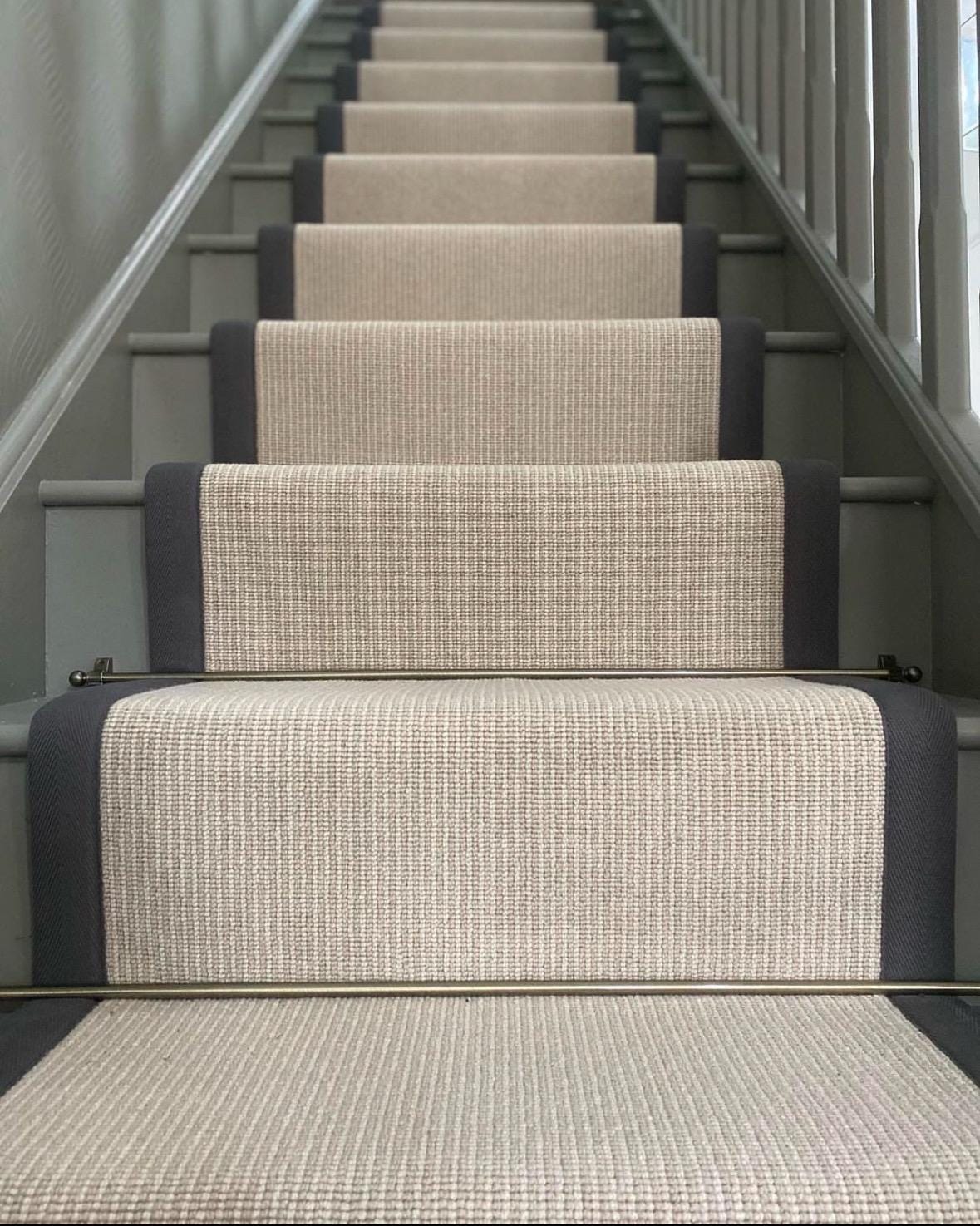 Beige stair runner with black stitched taped edge