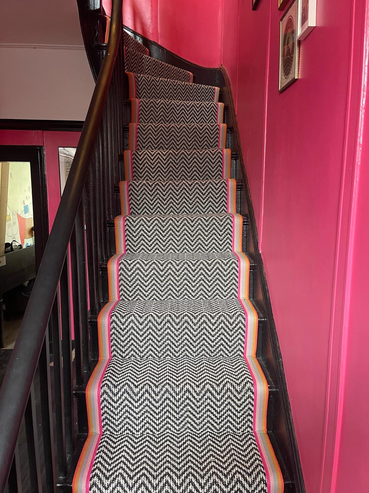 Black and white chevron multi coloured taped edge stair runner