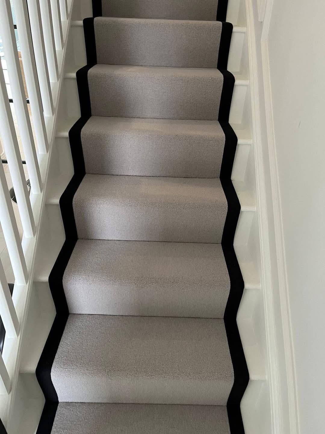 Grey Berber stair runner with stitched black taped edge