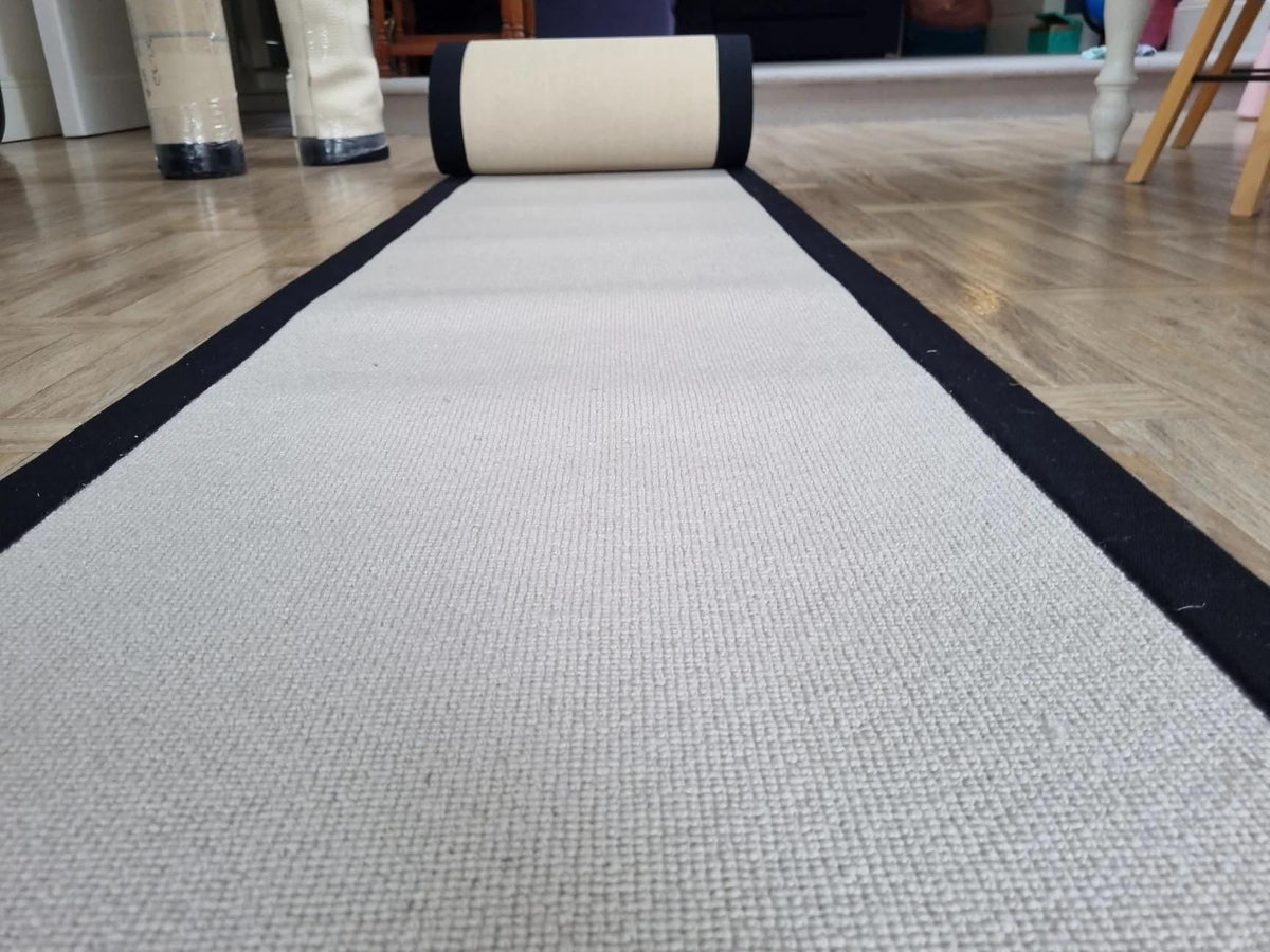 Grey Berber stair runner with stitched black taped edge