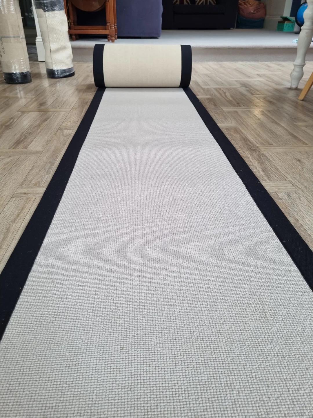 Grey Berber stair runner with stitched black taped edge