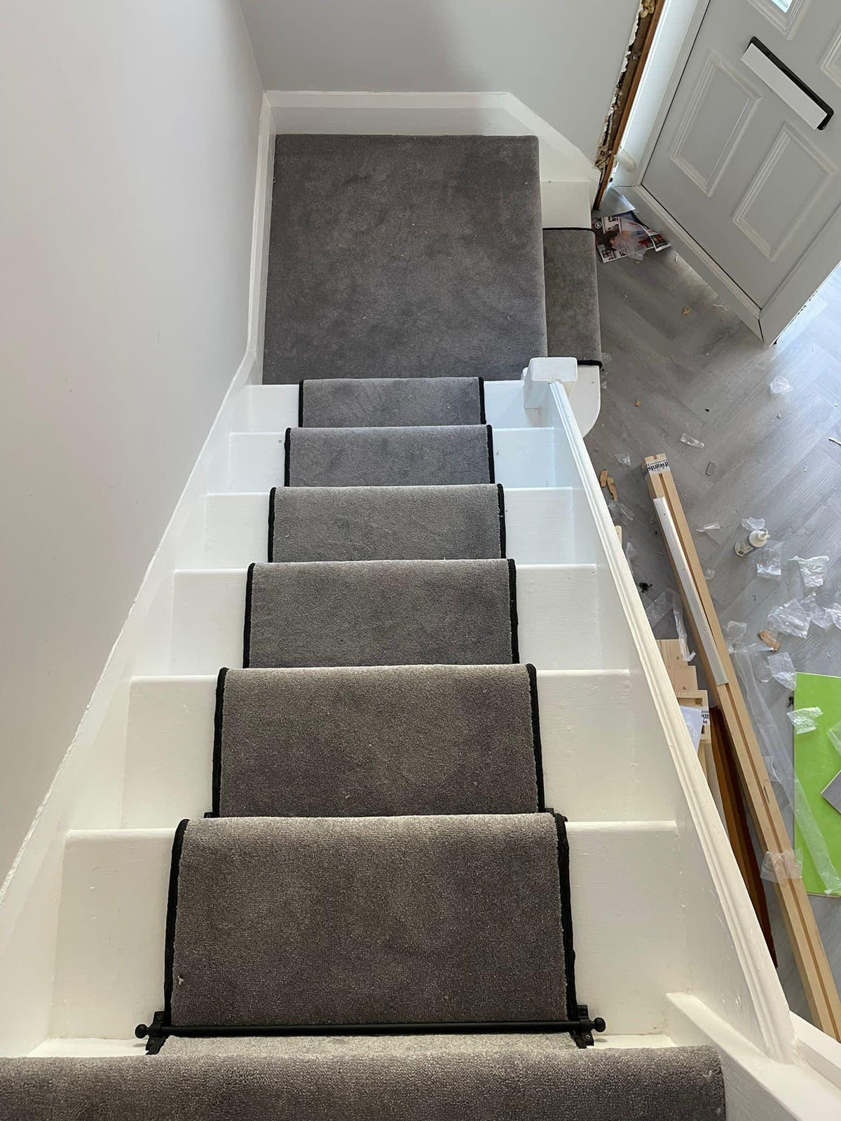 Grey stair runner with black whipped edge