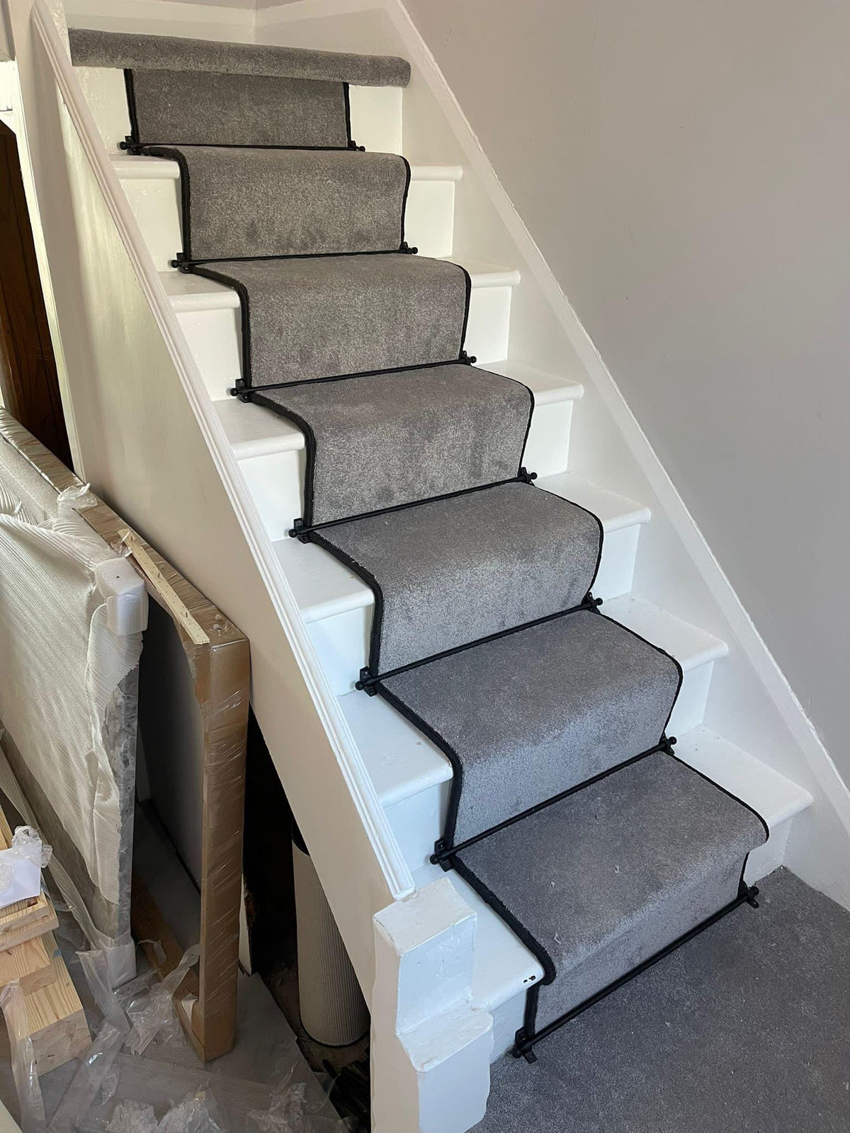 Grey stair runner with black whipped edge