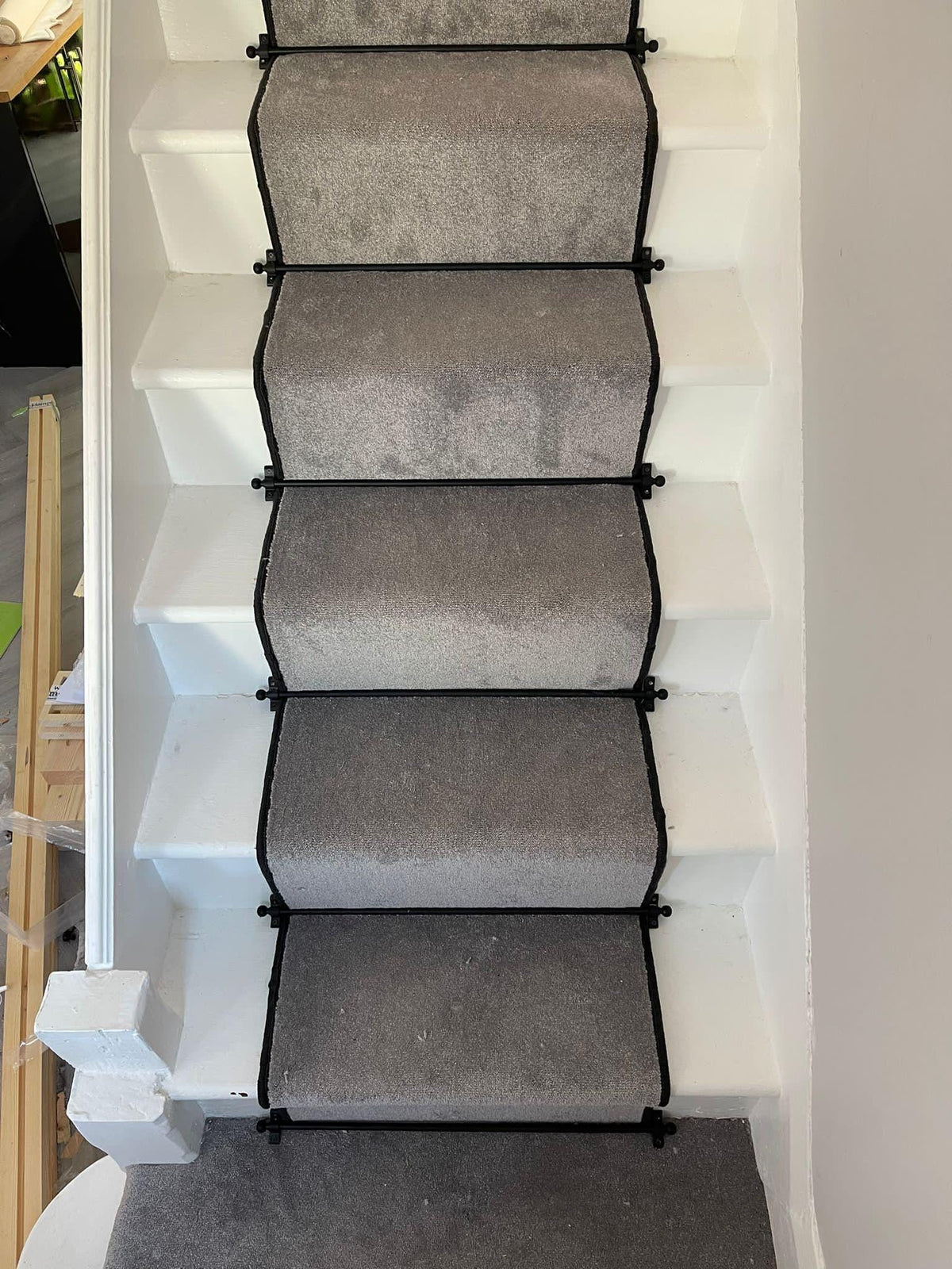 Grey stair runner with black whipped edge