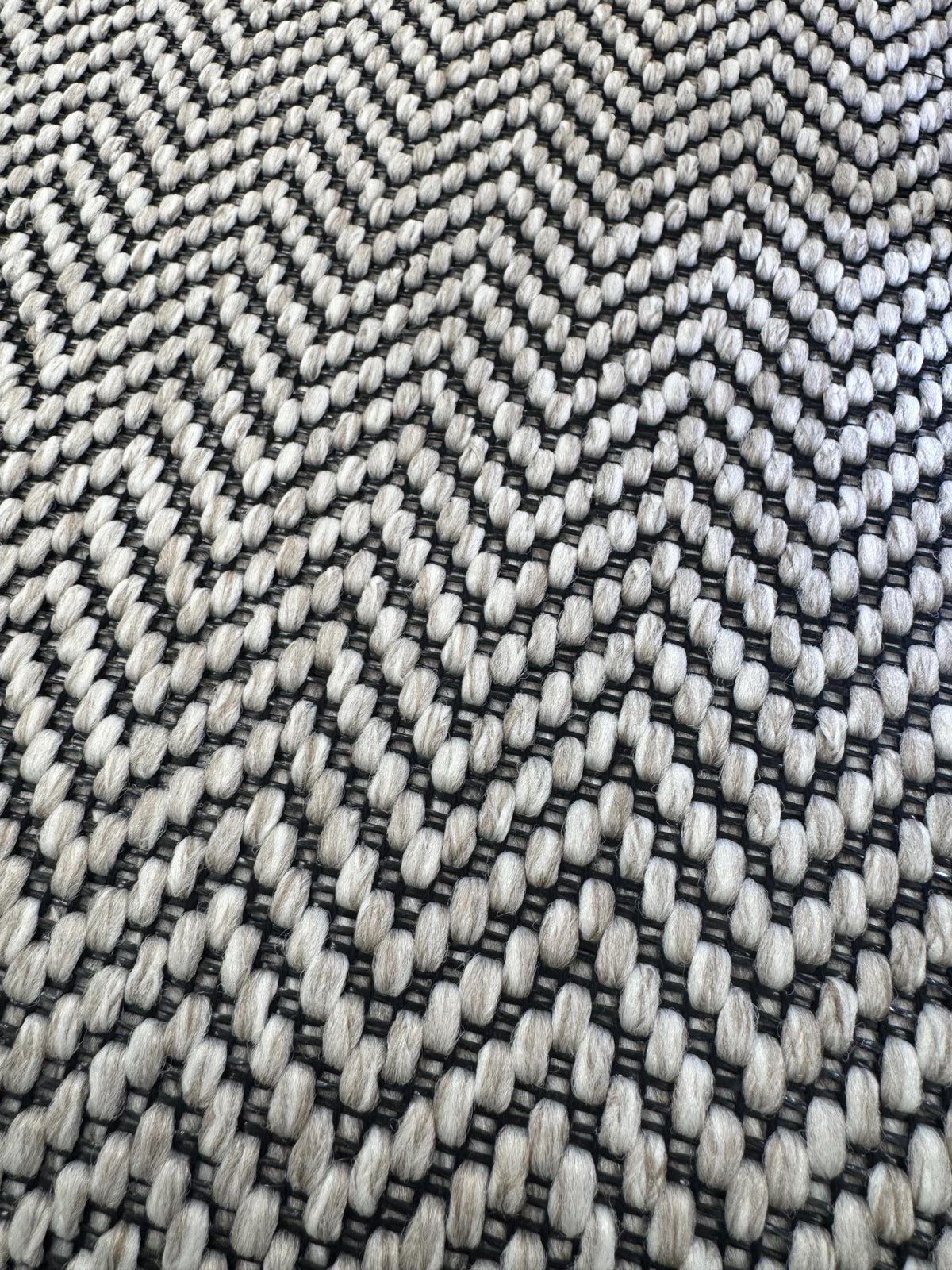 Ivory woven berber black stitched taped edge stair runner