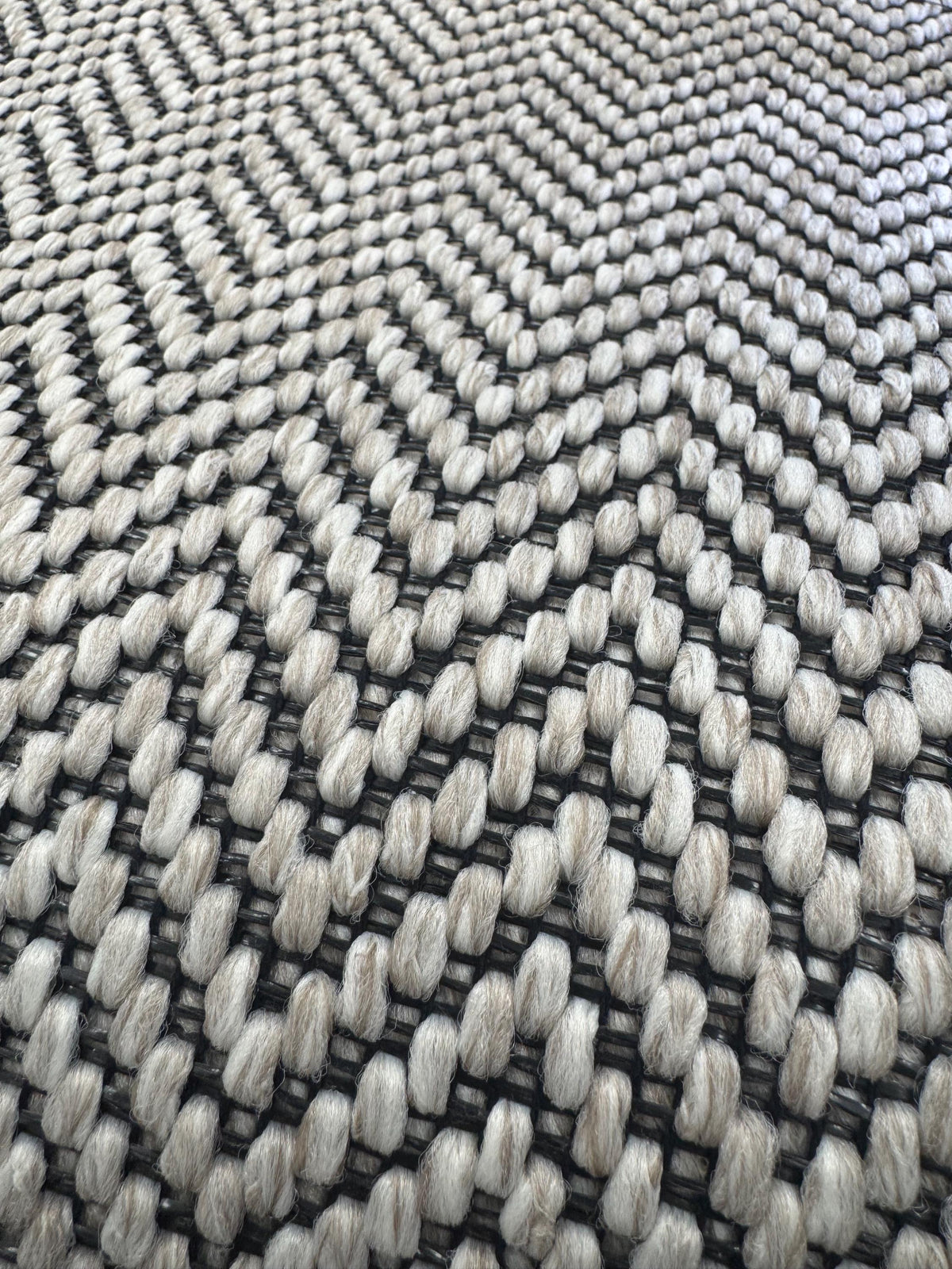 Ivory woven berber black stitched taped edge stair runner