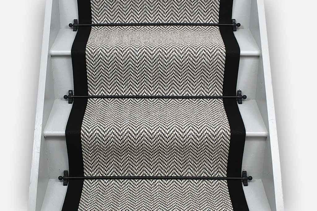 Ivory woven berber black stitched taped edge stair runner