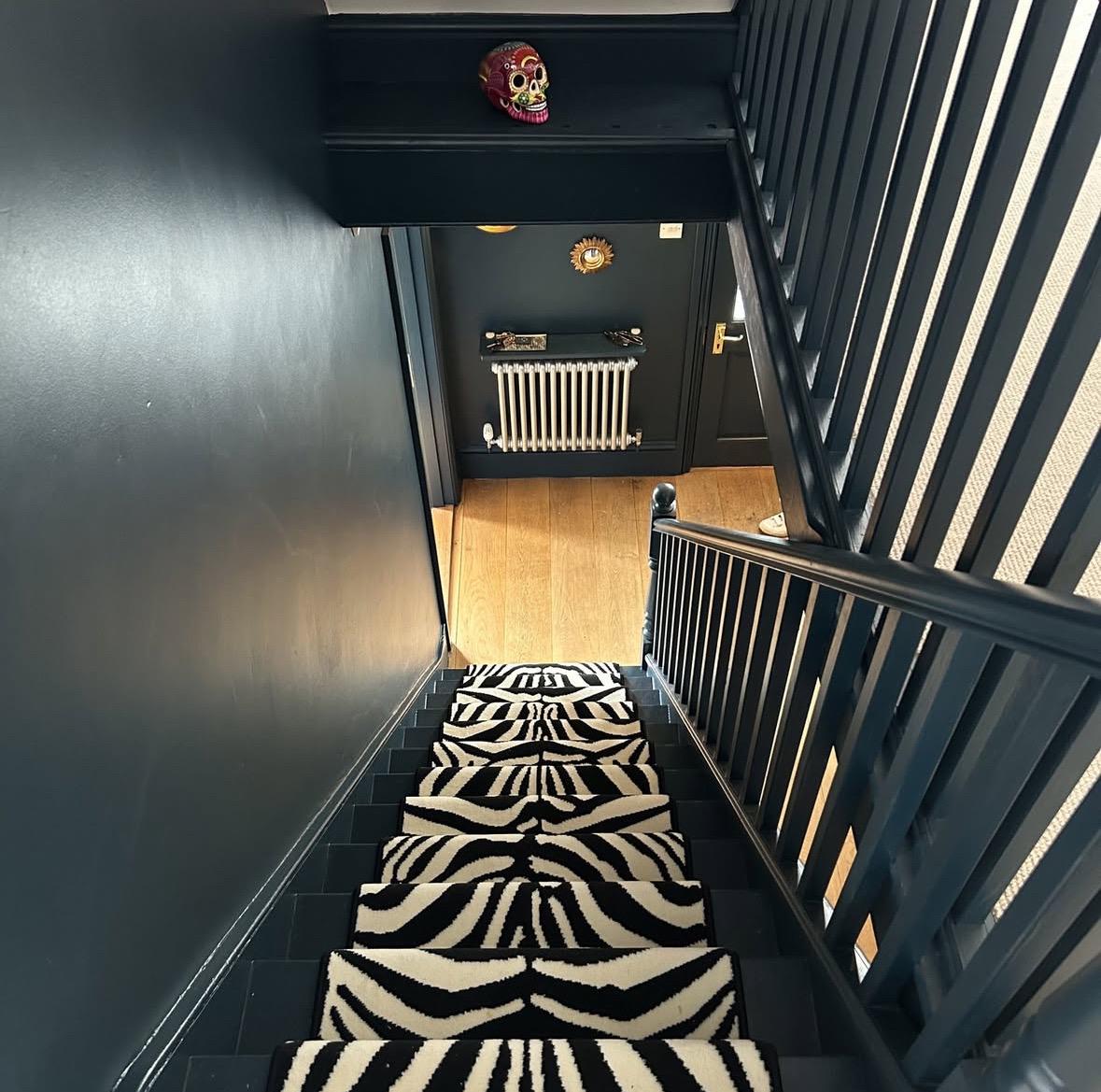 Zebra Wilton stair runner with black whipped edge