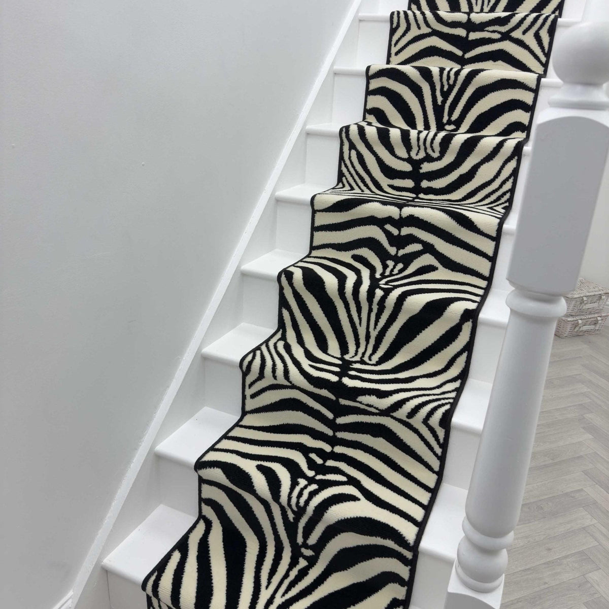 Zebra Wilton stair runner with black whipped edge